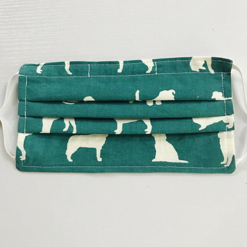 100% quilting-weight green with white dogs themed cotton face mask with adjustable elastic ear loops and bendable nose piece. Washable, reusable fabric face mask. Wash in washing machine and dry in dryer after each use. 7” H x 7.5” W